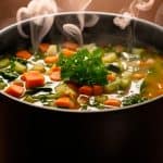 Steaming pot of vegetable soup.