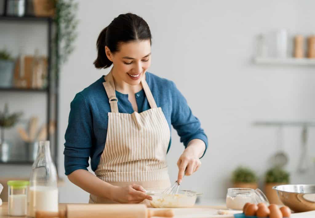 Person baking in a kitchen.