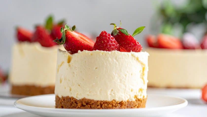 Lemon cheesecake topped with strawberries.