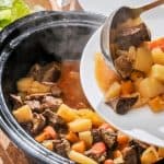 Serving beef casserole with vegetables