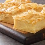 Layered dessert on wooden board