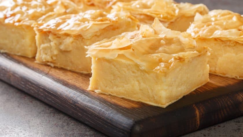 Layered dessert on wooden board