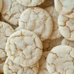 Cracked, round sugar cookies piled together