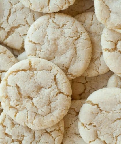 Cracked, round sugar cookies piled together