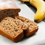 Sliced banana bread with bananas