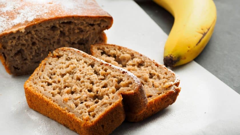 Sliced banana bread with bananas