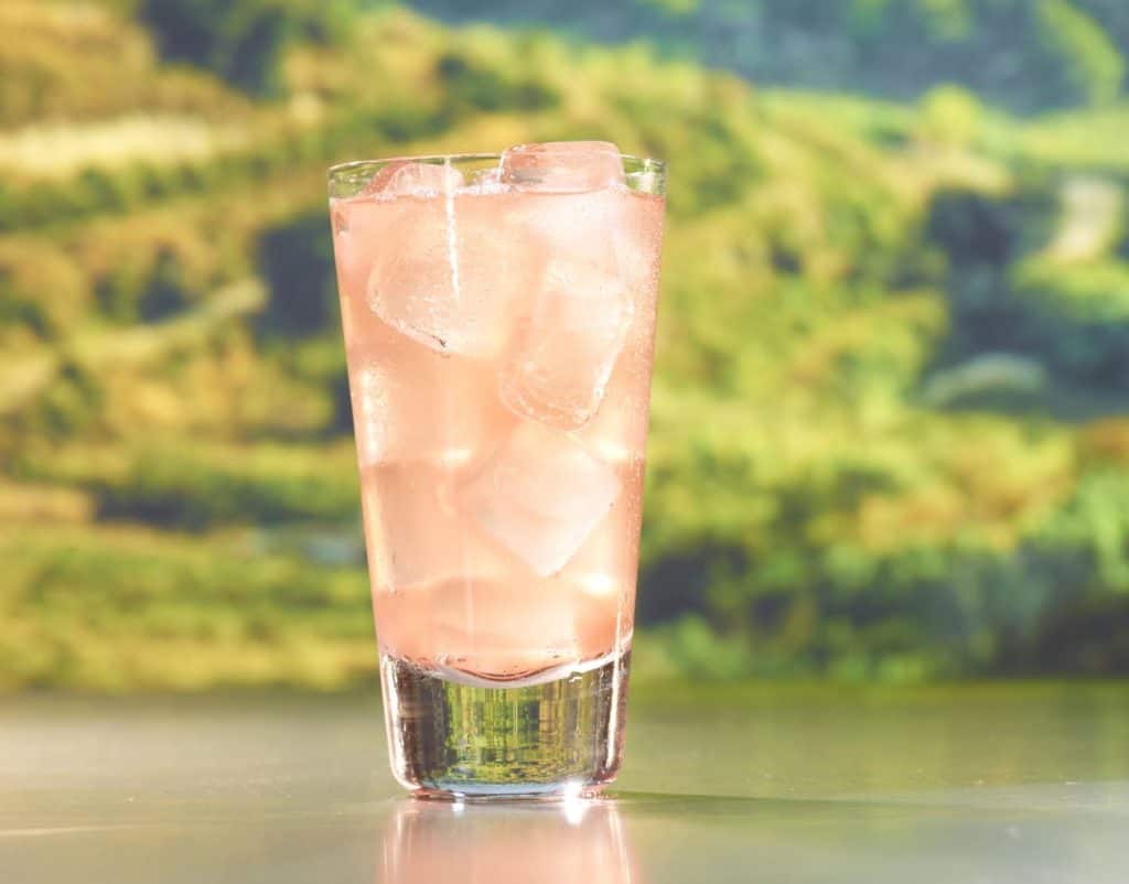 Pink drink with ice cubes