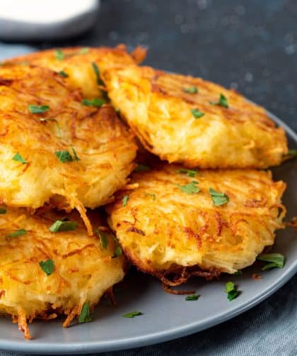 Crispy golden hash browns on plate