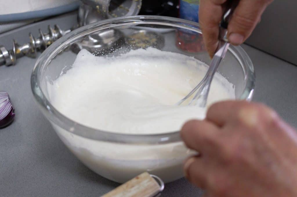 Whisking batter in a glass bowl