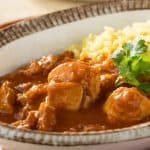 Chicken curry with yellow rice.