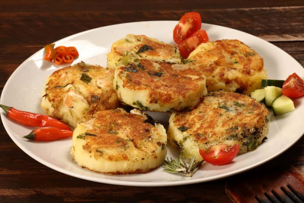 Fried potato cakes with vegetables