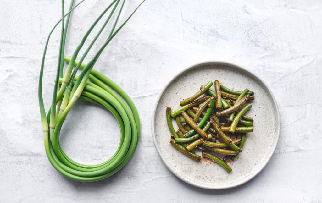 Green scapes and cooked garlic scapes.
