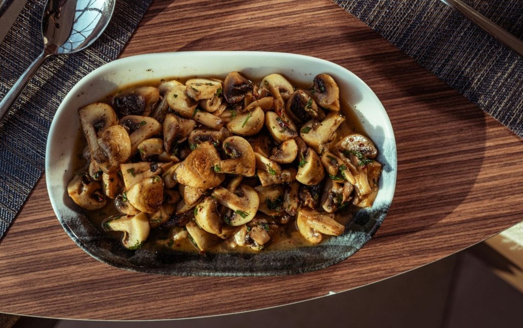 Sautéed mushrooms on a white dish