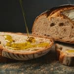 Sliced bread drizzled with olive oil
