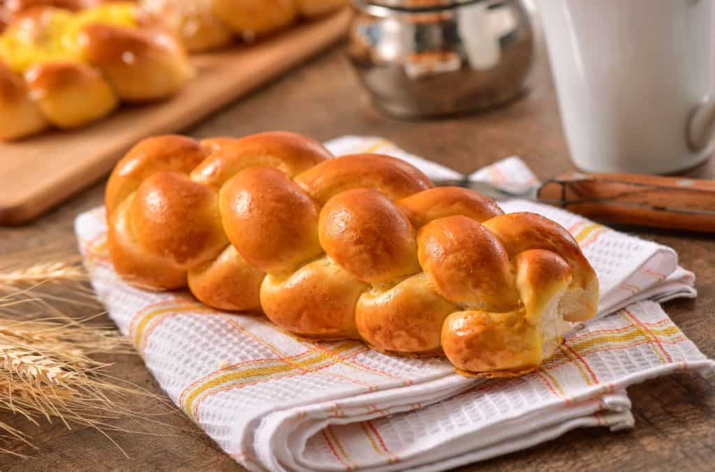Freshly baked braided bread on cloth
