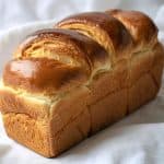 Golden, fluffy loaf of brioche bread