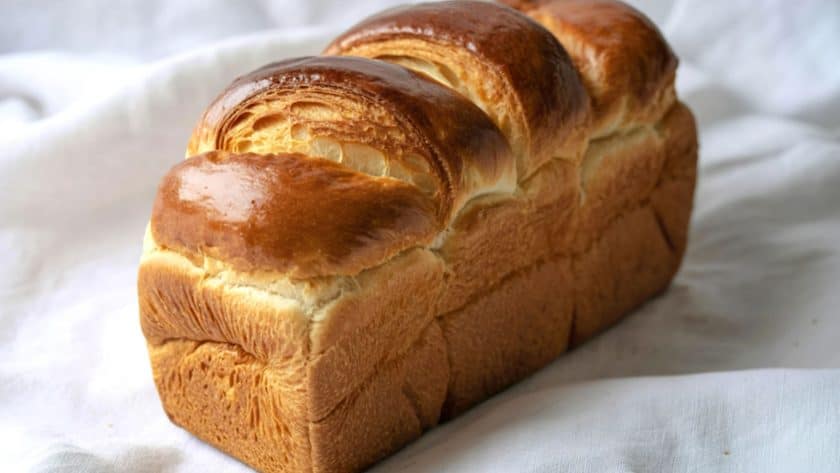 Golden, fluffy loaf of brioche bread