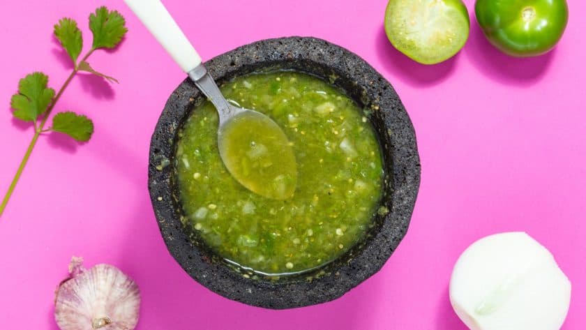 Green salsa in a stone bowl