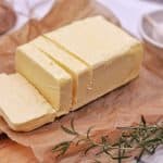 Block of butter on parchment paper