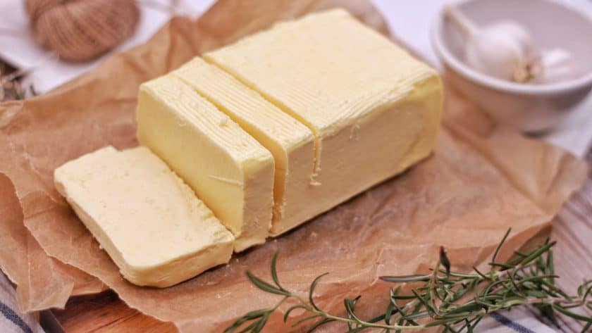 Block of butter on parchment paper