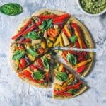 Colorful vegetable-topped pizza slices