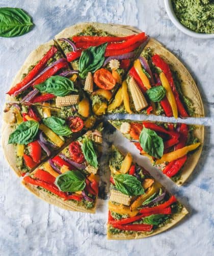 Colorful vegetable-topped pizza slices